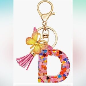 Initial D confetti initial purse charm with butterfly and tassel clips on